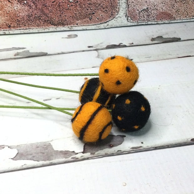 Round Orange with Black DotsWooly Bud on 18" Stem