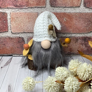 Aspen/Gnome with White Knit Hat & Flora on Natural Wood Base